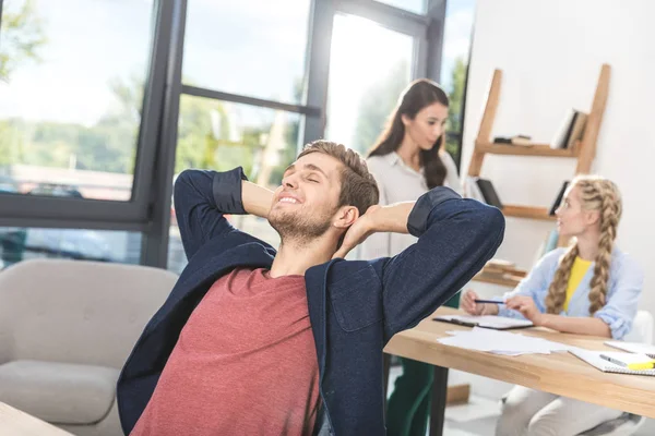 Businessman relaxing in office — Stock Photo, Image