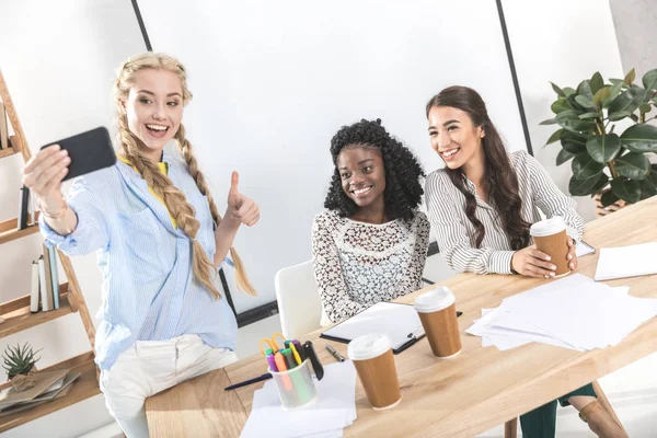 Multicultural businesswomen taking selfie — Stock Photo, Image