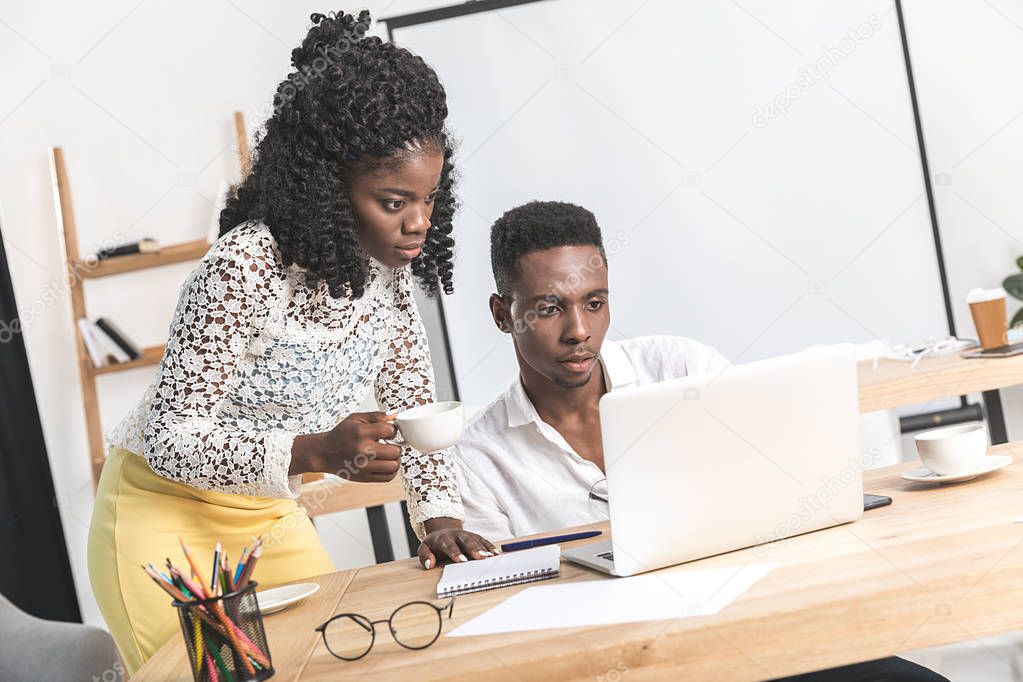 african american businesspeople working on laptop
