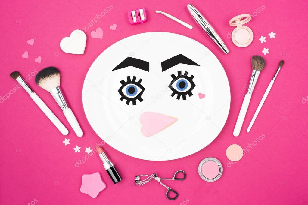 paper face with makeup on plate 