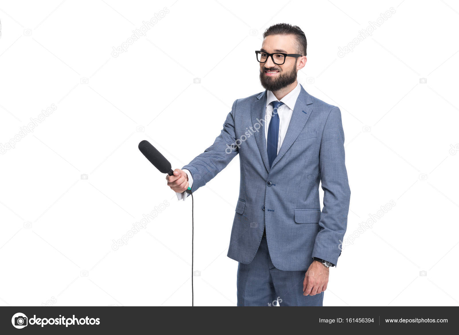 Journalist Taking Interview With Microphone Stock Photo