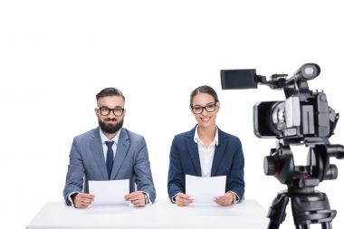 newscasters sitting in front of camera clipart