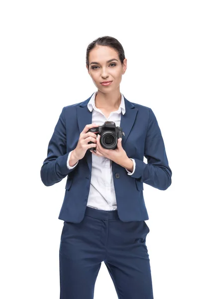 Empresária segurando câmera profissional — Fotografia de Stock