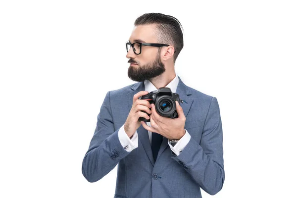 Hombre de negocios sosteniendo cámara — Foto de Stock