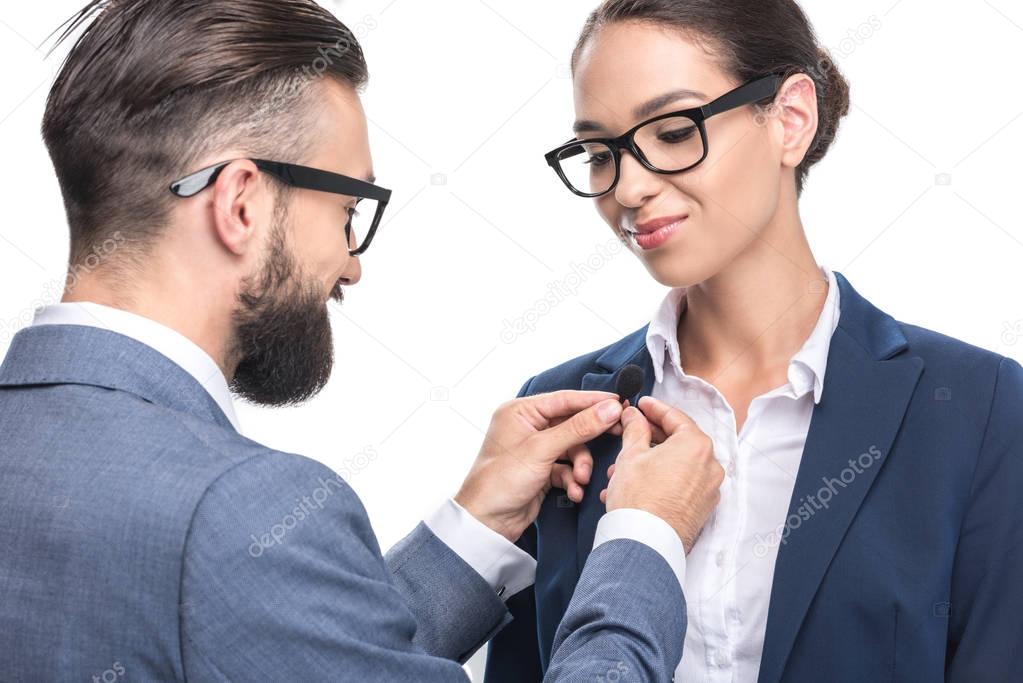 man hanging tie clip microphone 