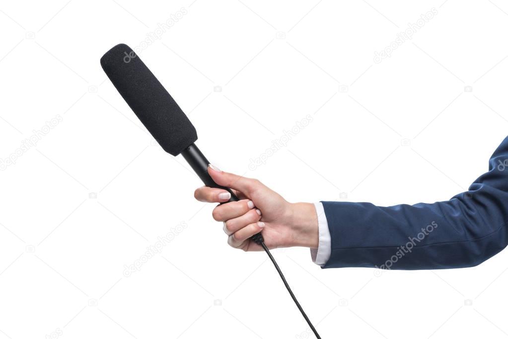 holding microphone for interview
