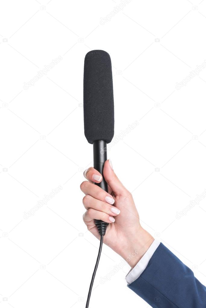 holding microphone for interview