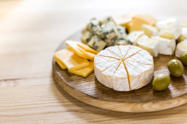 various cheese types and olives clipart