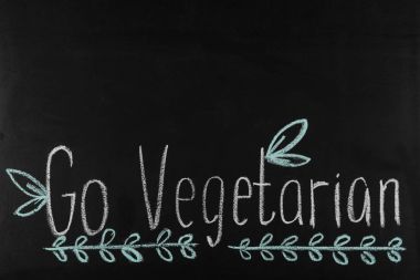 go vegetarian lettering on blackboard