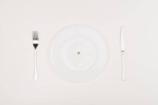 pea on plate, cutlery