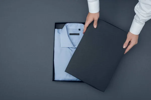 Tailor with shirt in box — Stock Photo, Image