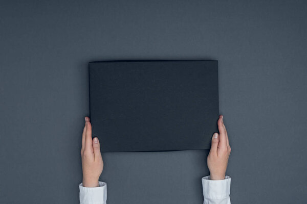 tailor holding box for shirt