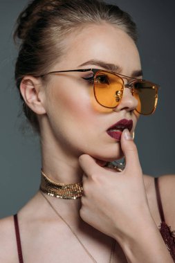seductive model in orange sunglasses clipart