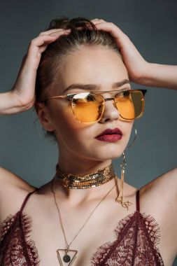 seductive model in orange sunglasses clipart