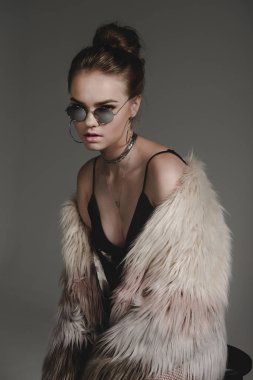 girl in sunglasses and fur coat clipart