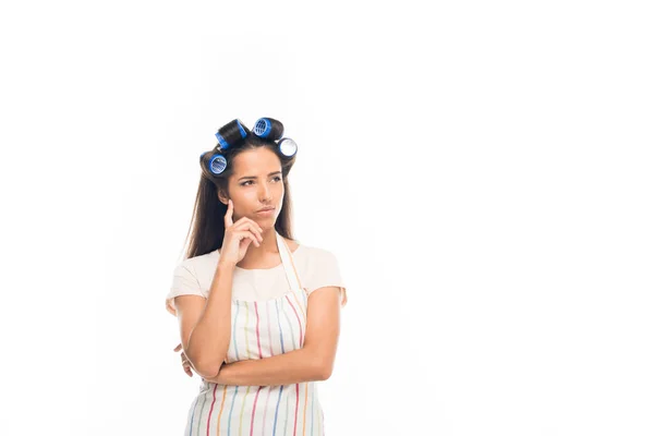 Thoughtful housewife with curlers — Free Stock Photo