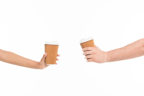 Hands holding disposable cups — Stock Photo, Image