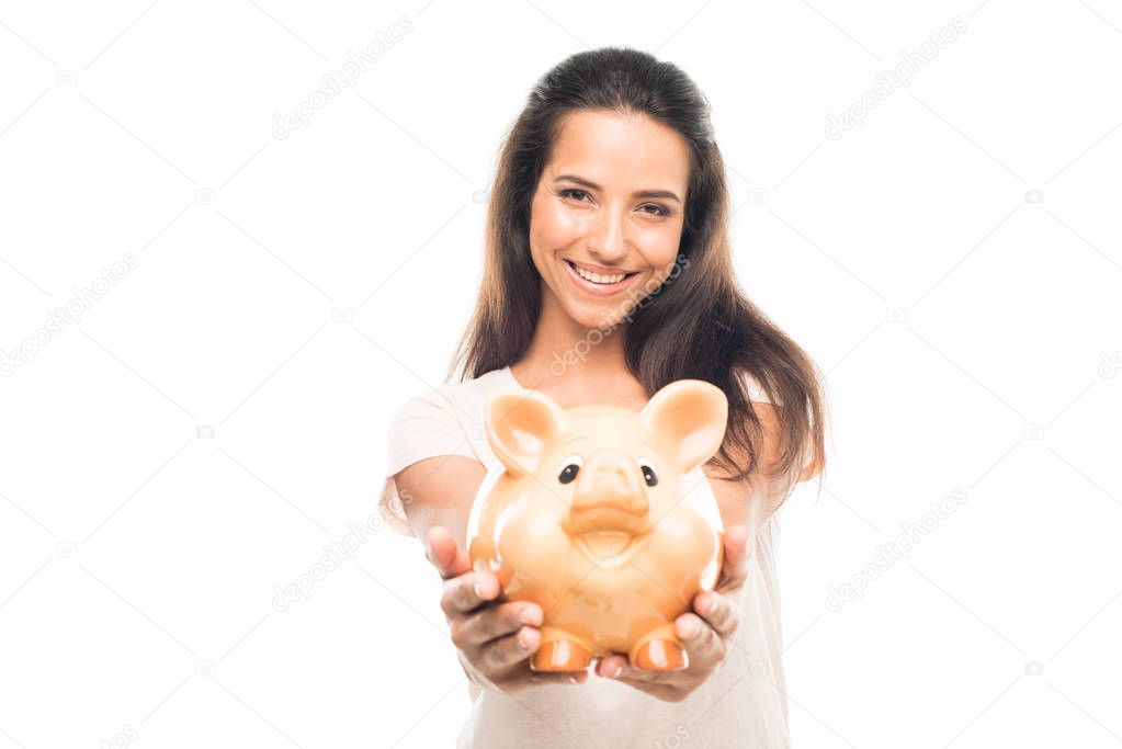 attractive woman with piggy bank