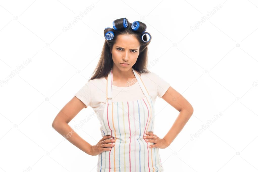Angry housewife with hands on hips