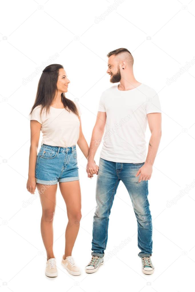 young attractive couple holding hands