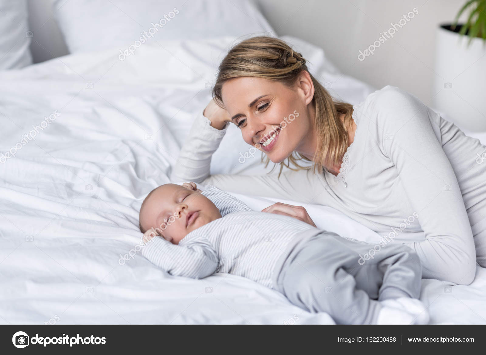 Mother with sleeping baby — Stock Photo © AllaSerebrina 162200488