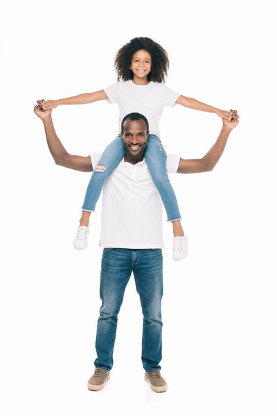 african american father carrying daughter 