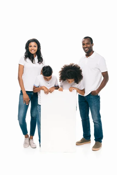 Happy african american family with banner — Stock Photo, Image
