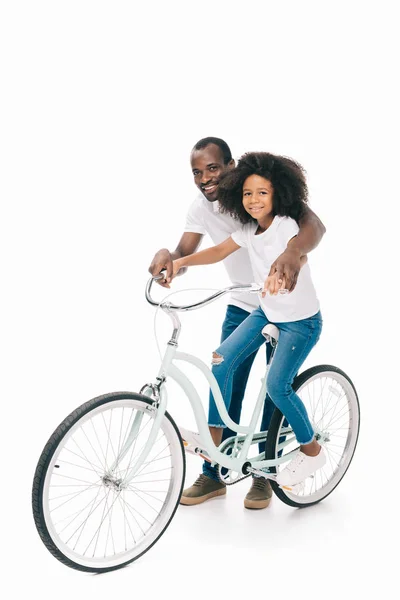 Father teaching daughter riding bicycle — Stock Photo, Image