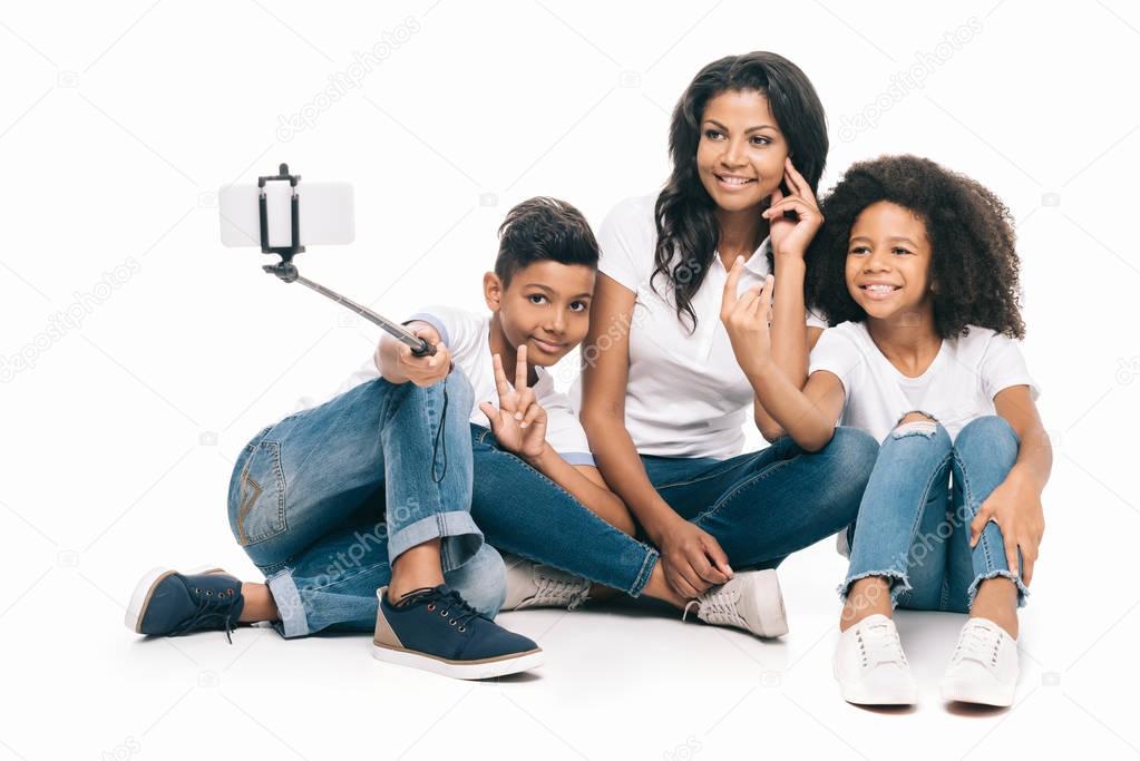 mother with kids taking selfie
