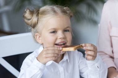 child eating toast with jam clipart