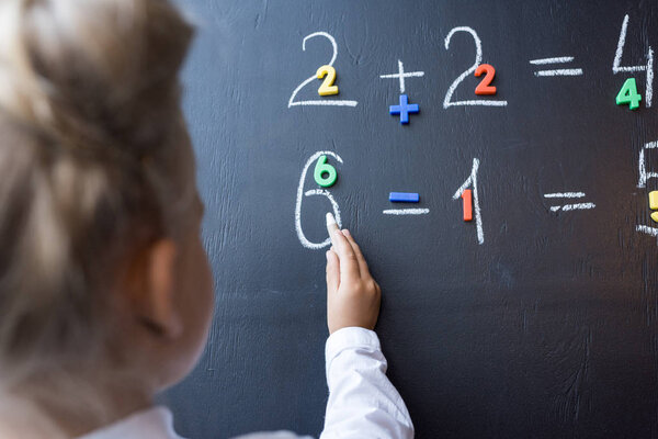 child studying numbers