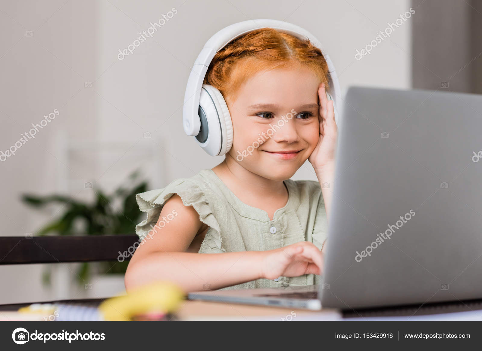 Little girl with headphones and laptop Stock Photo by ©AllaSerebrina ...