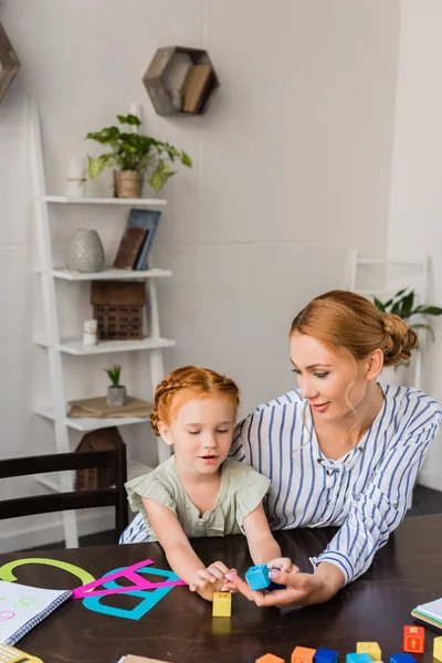 Mother and daughter learning alphabet — Stock Photo, Image
