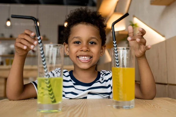 African american child drinking juice — Stock Photo, Image