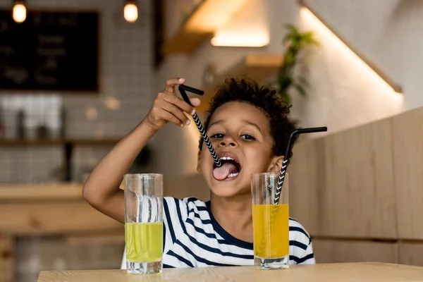 African american child drinking juice — Stock Photo, Image