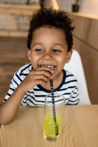 African american child drinking juice — Stock Photo, Image