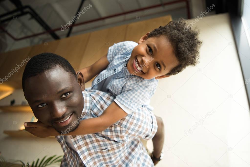 african american father and child hugging