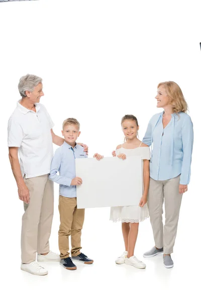 Family with empty board — Free Stock Photo