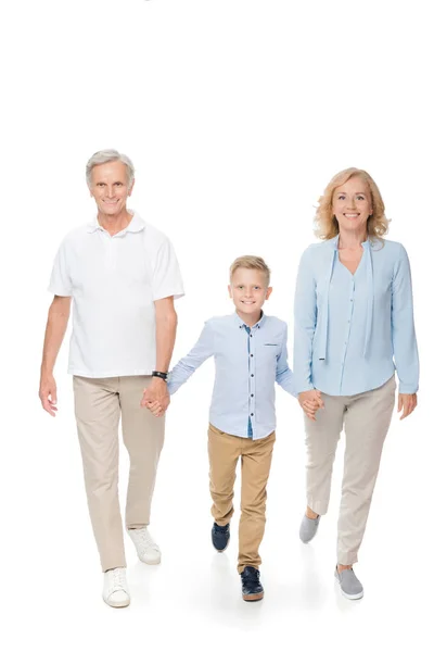 Grandparents with grandchild holding hands — Free Stock Photo