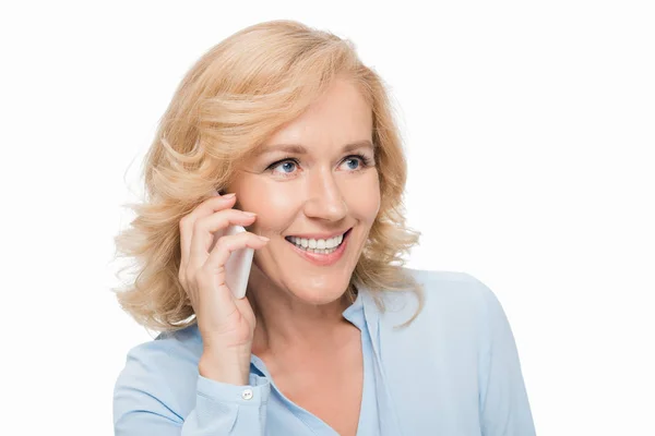 Mature woman talking by phone — Stock Photo, Image