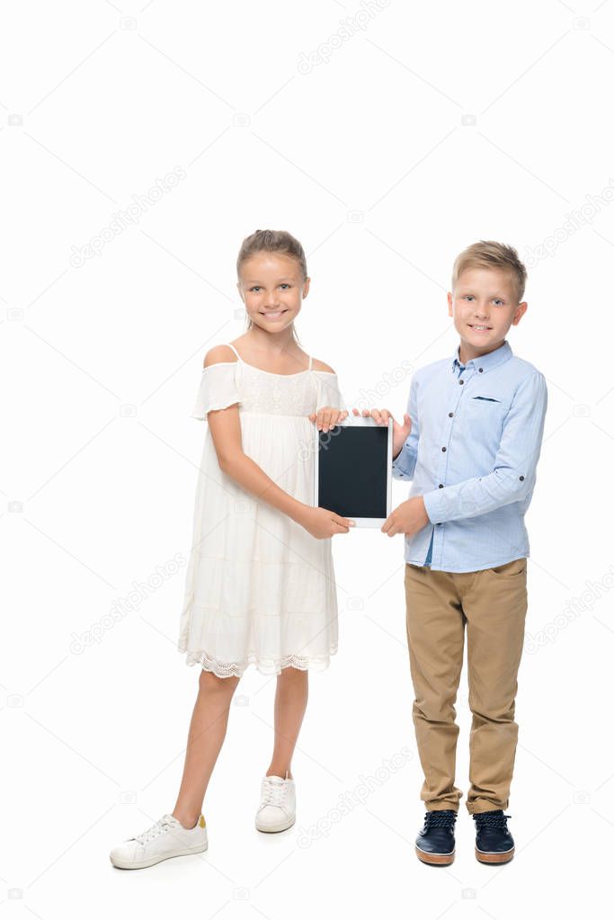 siblings with digital tablet 