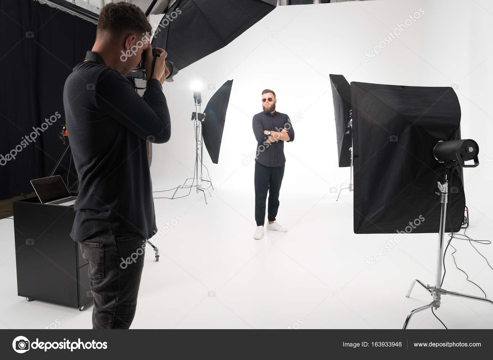 Photographer working in studio with model — Stock Photo © AllaSerebrina