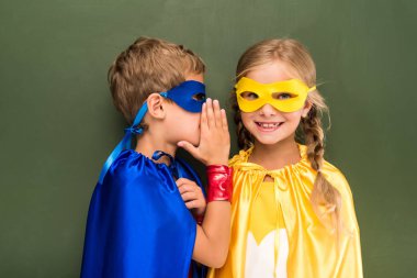 gossiping pupils in superhero costumes  clipart
