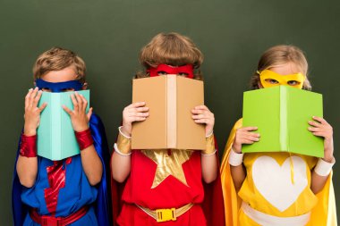 little superheroes with books clipart