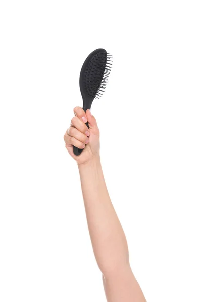 Mão segurando escova de cabelo — Fotografia de Stock