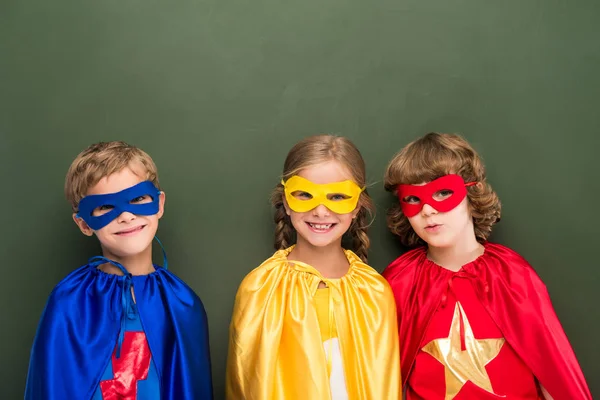 Kids in superhero costumes — Stock Photo, Image