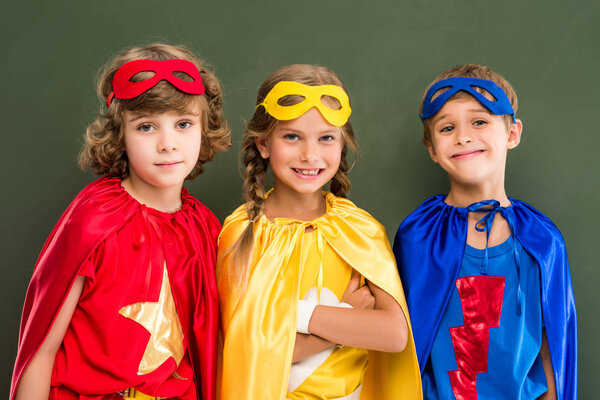 pupils in superhero costumes
