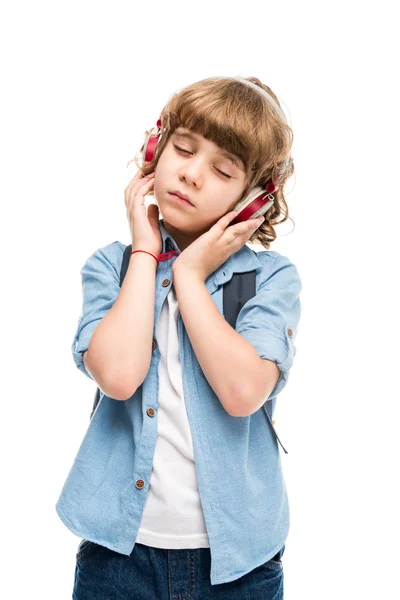 Schoolboy listening music — Stock Photo, Image