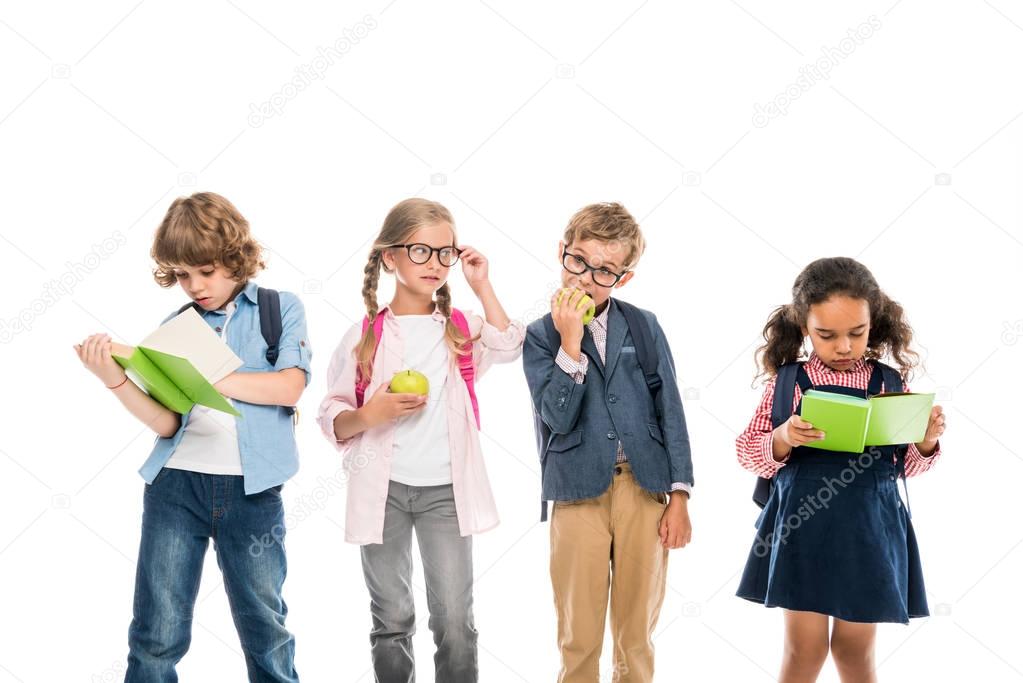 multiethnic schoolchildren with books