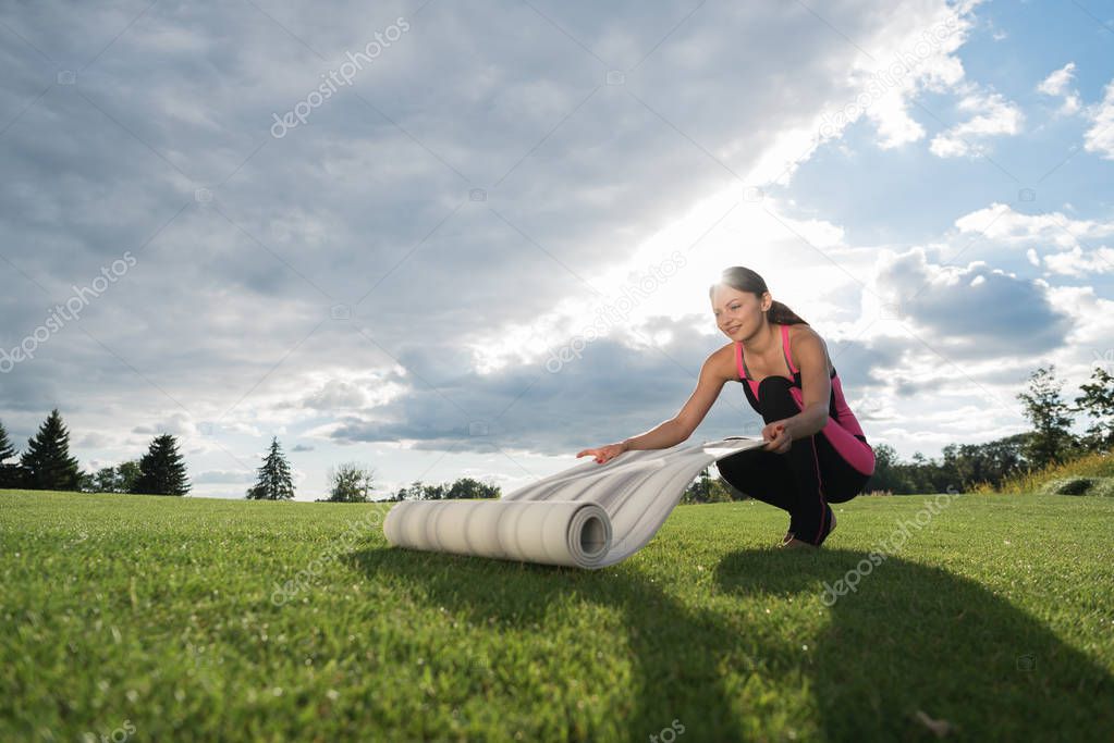 woman preparing for doing yoga